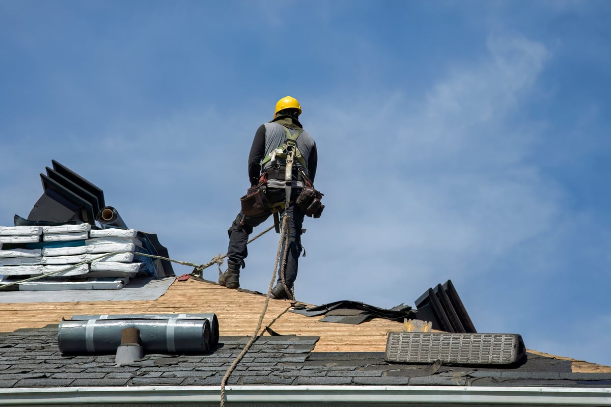 Professional roofing contractor at work